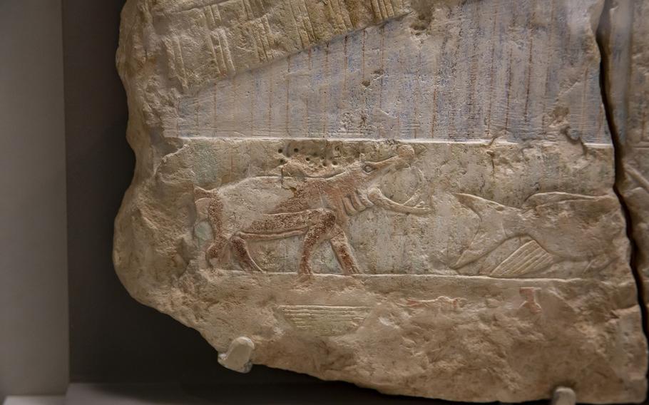 hippopotamus and fish art on a stone